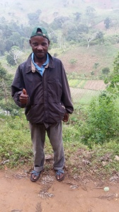 Project Partner and Organic Coordinator Mngoma, whose farm plot is in the valley behind him