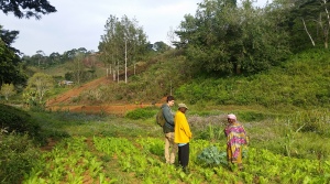 Project Partner Aziza (right) showing Partner Hamisi and me the plot where she plans to plant organic 2Seeds vegetables